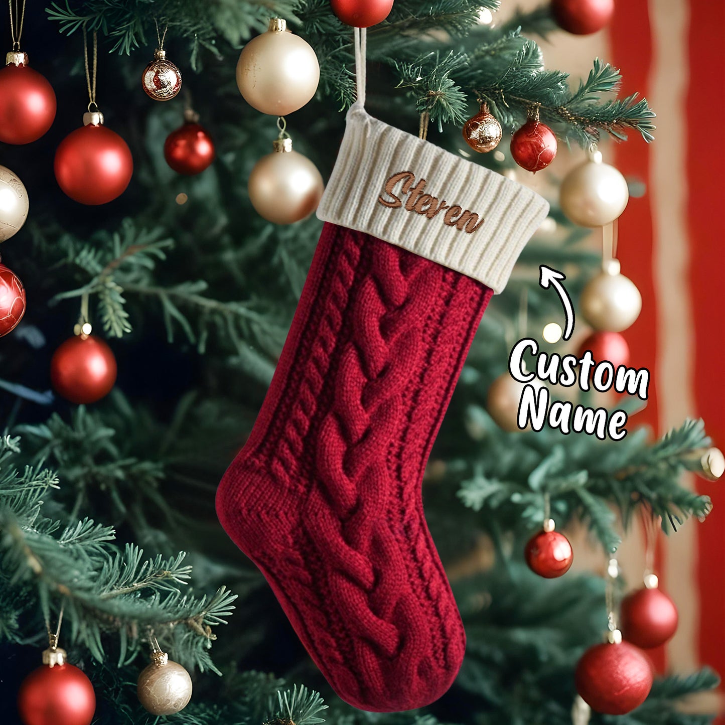 Red knitted Christmas stocking with 'Steven' name on it hanging on a decorated tree.