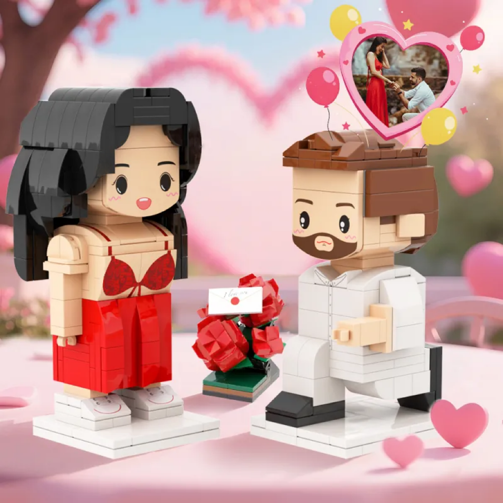 Two brick-built figures of a man and woman with cherry blossoms and balloons in the background.