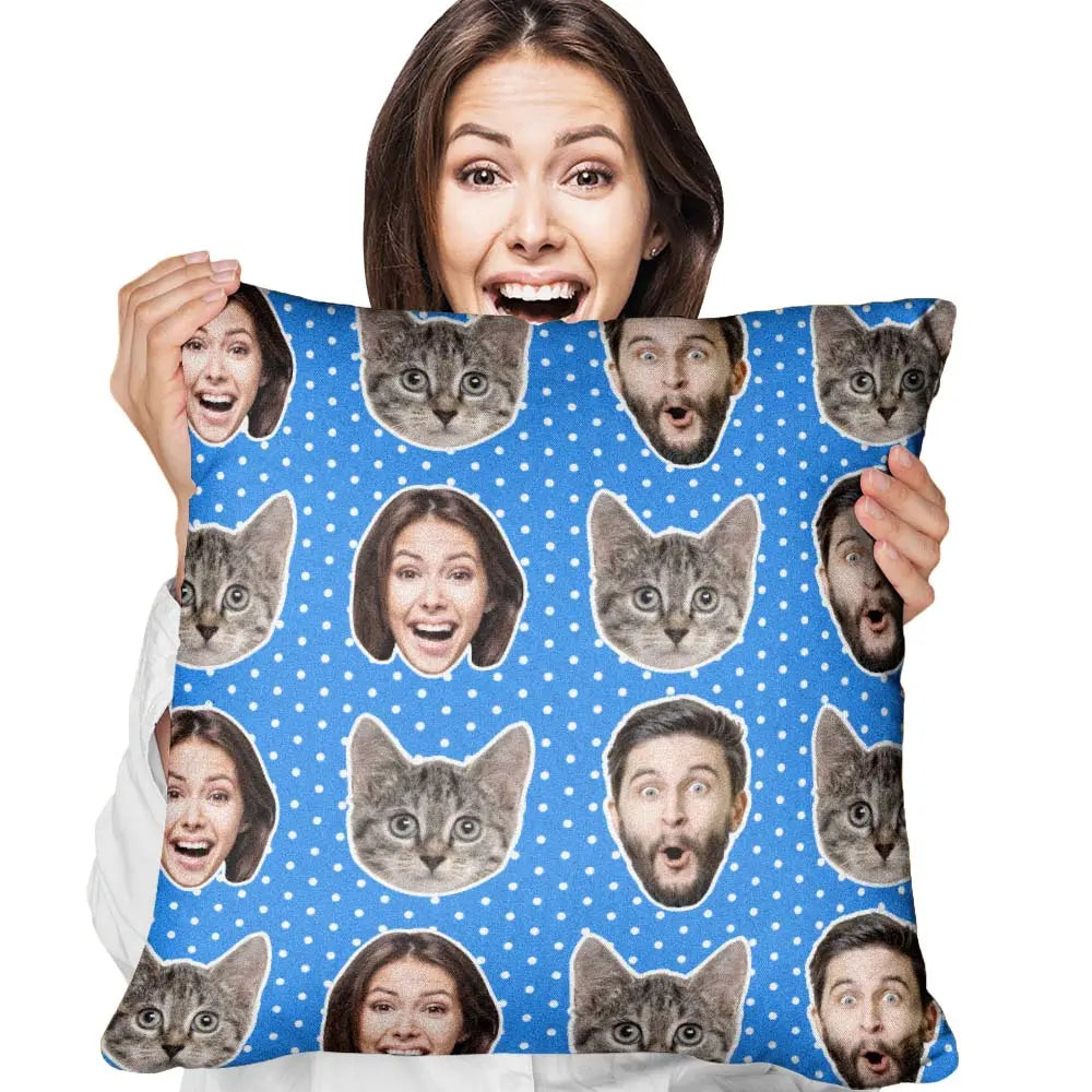 Person holding a pillow with cat and face pattern on a blue background