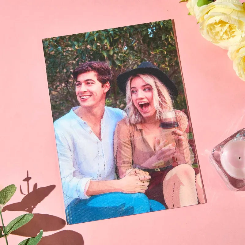 Couple holding hands with a pink background