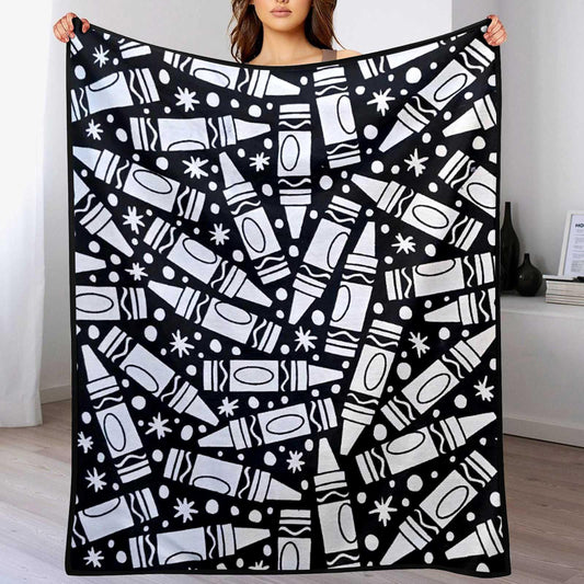 Person holding a black and white patterned blanket
