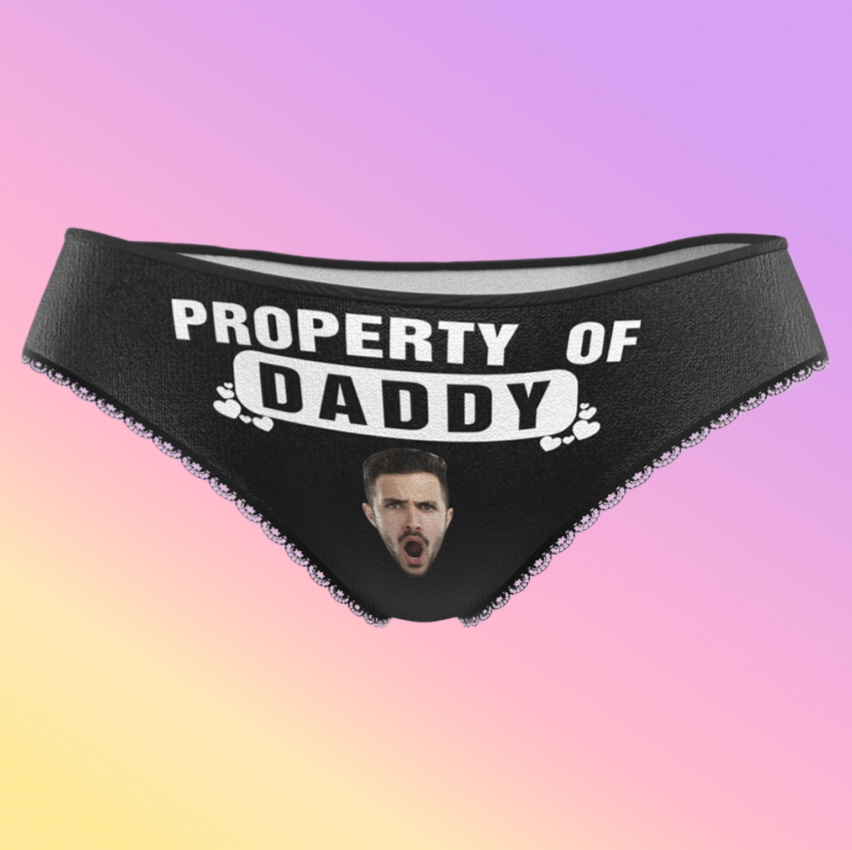 Black underwear with 'Property of Daddy' text on a gradient background