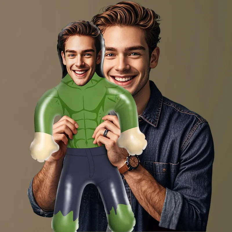 Man holding a cardboard cutout of a superhero with a plain background