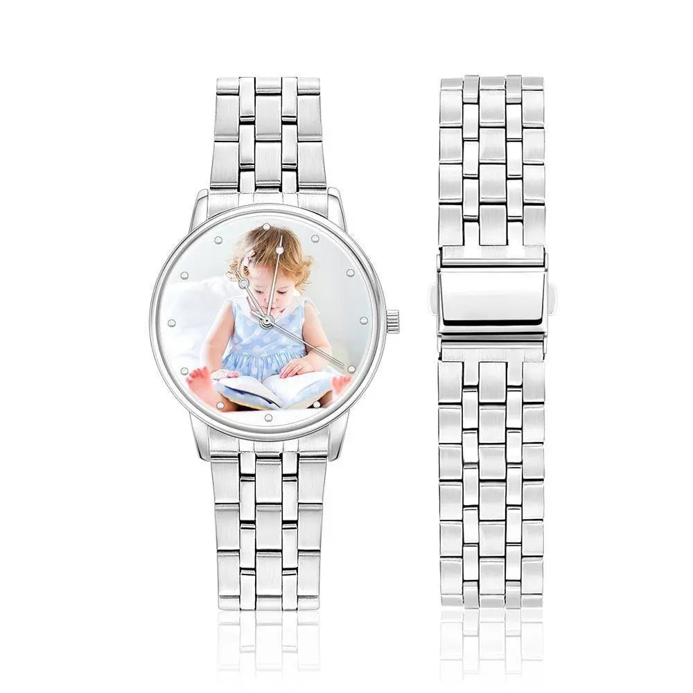 Silver watch with a photo of a child on the face, on a white background