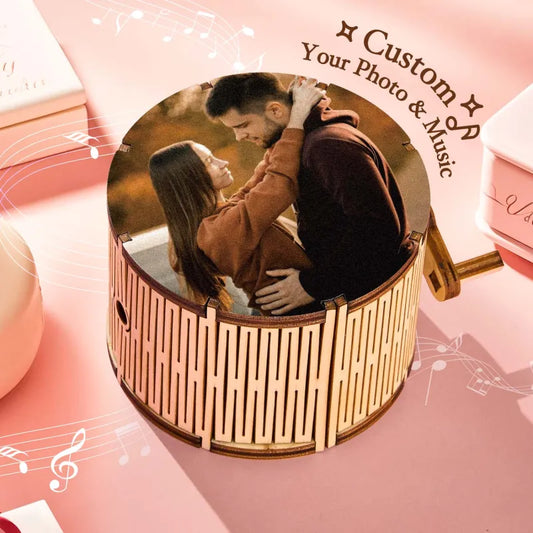 Round wooden music box with a couple photo and text 'Custom Your Photo & Music' on a pink background.