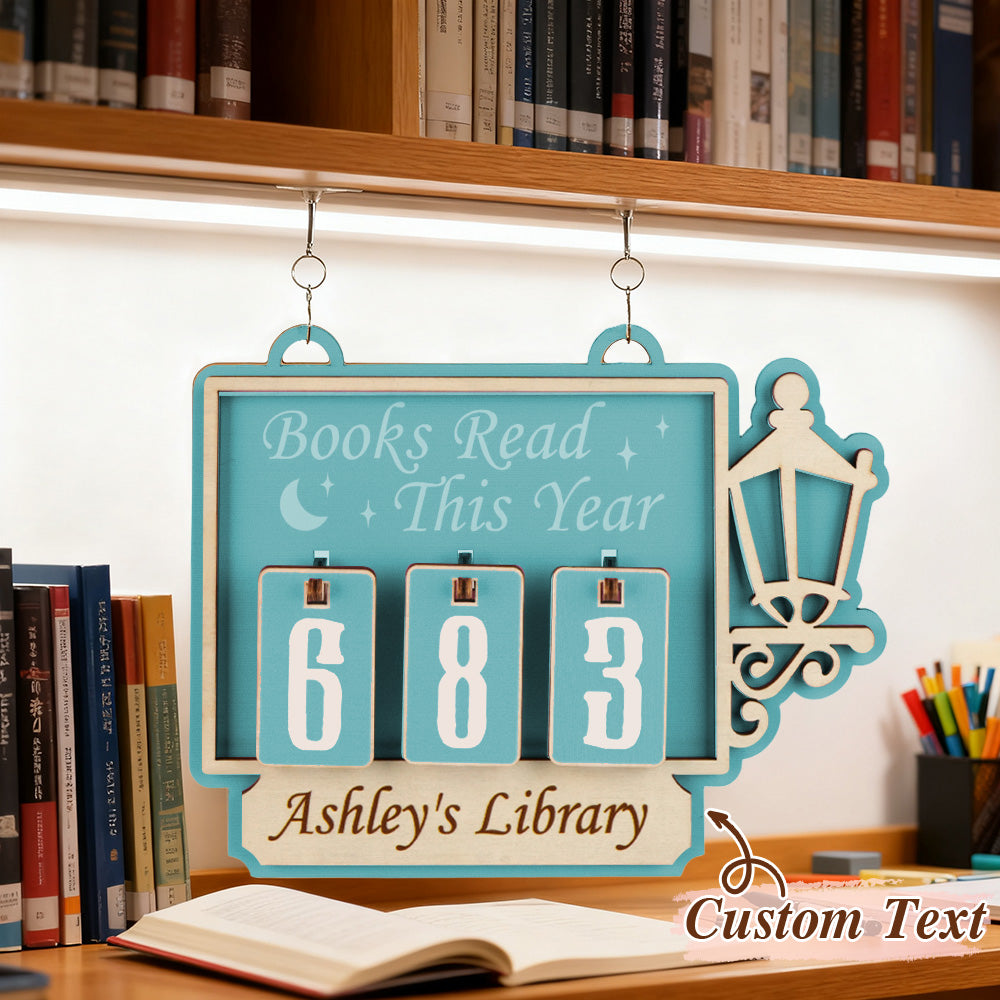 Decorative sign with 'Books Read This Year' counter in a library setting