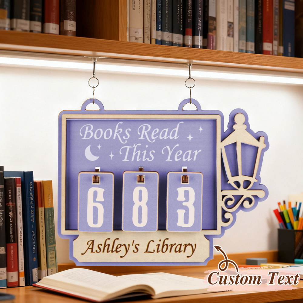 Decorative plaque with 'Books Read This Year' counter in a library setting