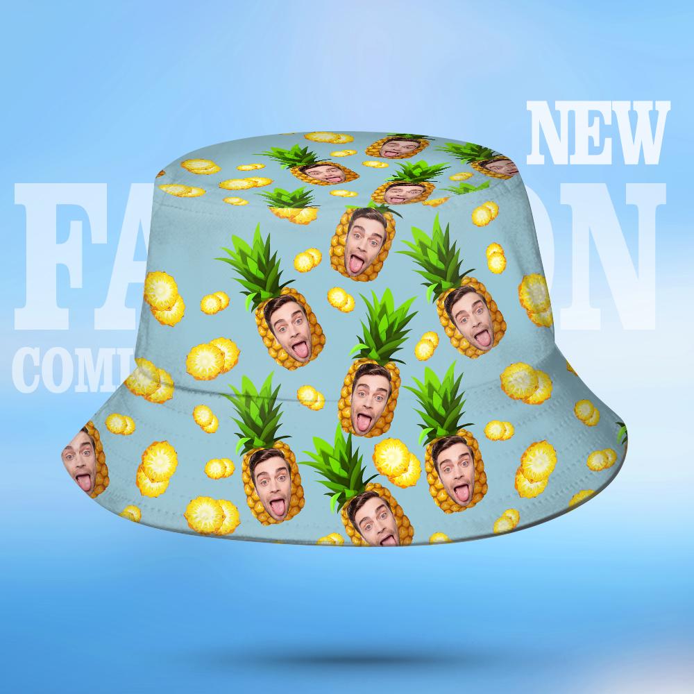 Bucket hat with pineapple and face pattern on a blue background