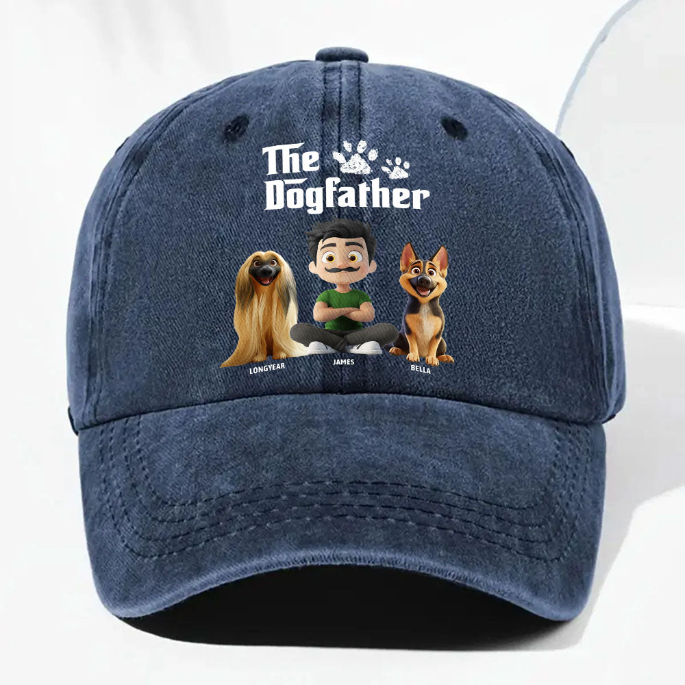 A navy blue washed cotton baseball cap featuring a custom cartoon graphic of a man labeled 'The Dogfather' with three dogs named 'Zhanghuan', 'James', and 'Max' printed on the front.