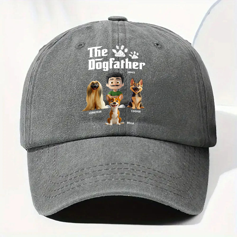 A dark gray baseball cap featuring a custom printed graphic on the front with the text 'The Dogfather' and cartoon illustrations of four dogs with their names underneath.
