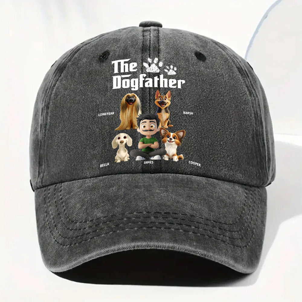 A dark gray washed baseball cap featuring a custom cartoon dogfather graphic with the text 'The Dogfather' and illustrated characters representing different dog breeds.