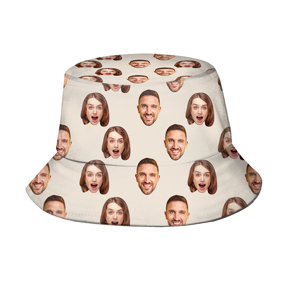 Bucket hat with printed faces on a beige background