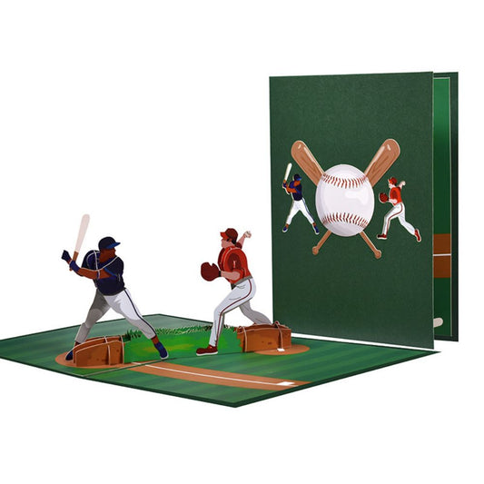 A 3D pop-up greeting card featuring a baseball game scene with a player batting, a pitcher throwing, and a catcher in position. The card is open, displaying the intricate three-dimensional design.