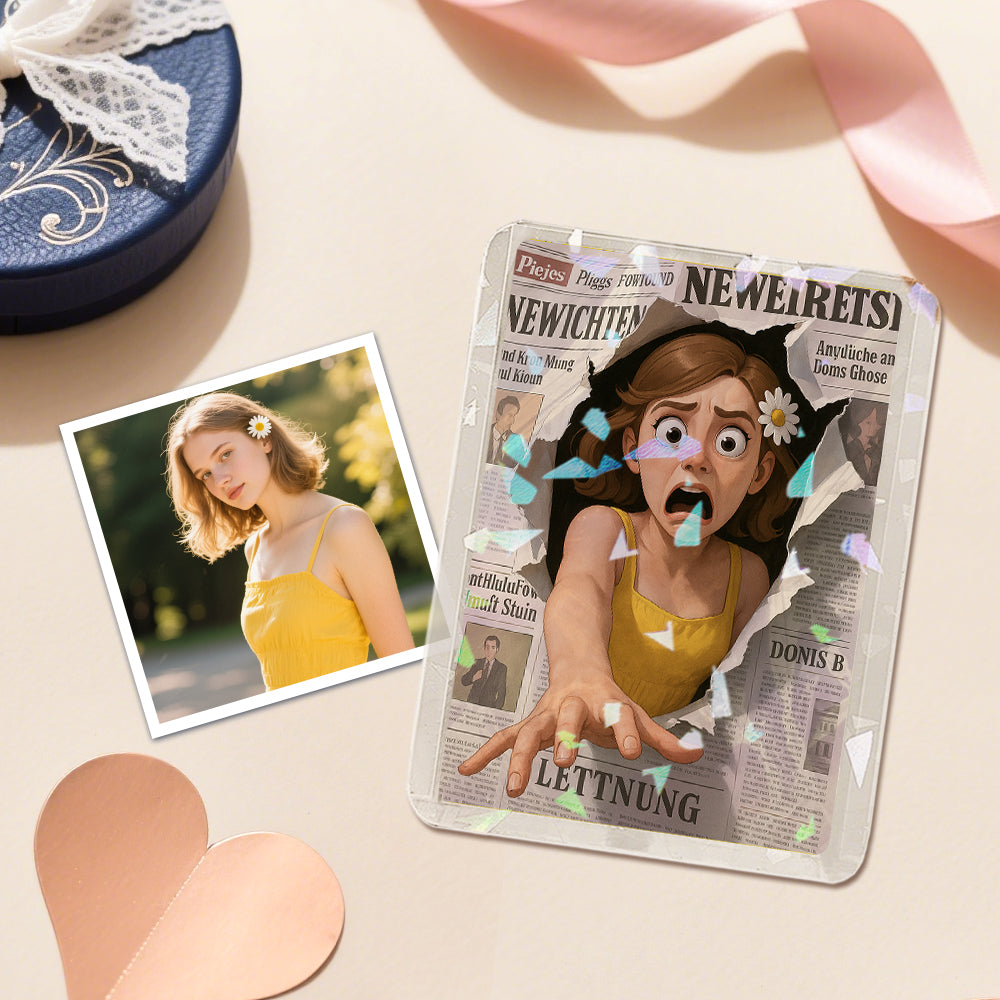Product packaging with a printed design of a woman in a yellow dress, placed on a surface with a heart-shaped box and ribbon.