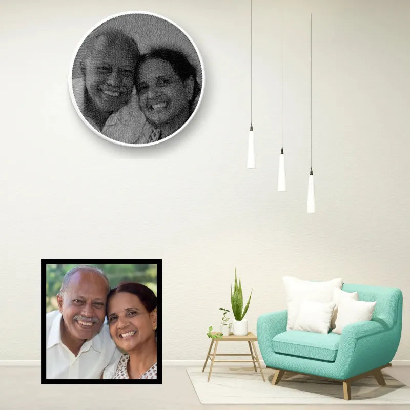 Living room with a teal armchair, framed photo of a couple, and circular wall art.