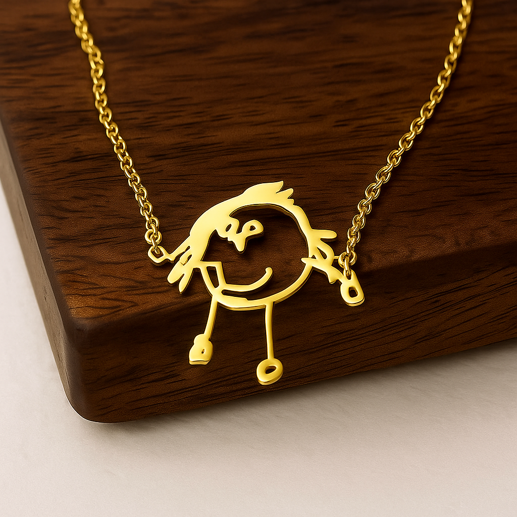 Gold necklace with a unique pendant on a wooden surface