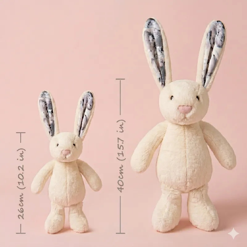 Two plush bunny toys with floral ears on a pink background, showing measurements.