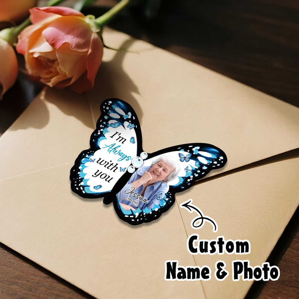 Butterfly-shaped photo frame with a custom photo on a wooden surface with roses.