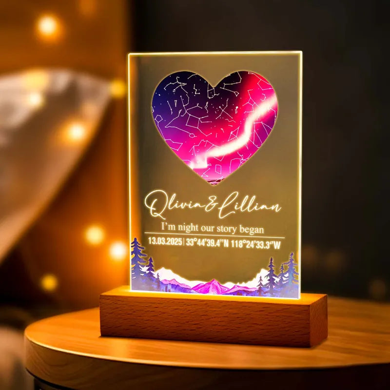 Decorative LED night light with heart design and personalized text on a wooden base.