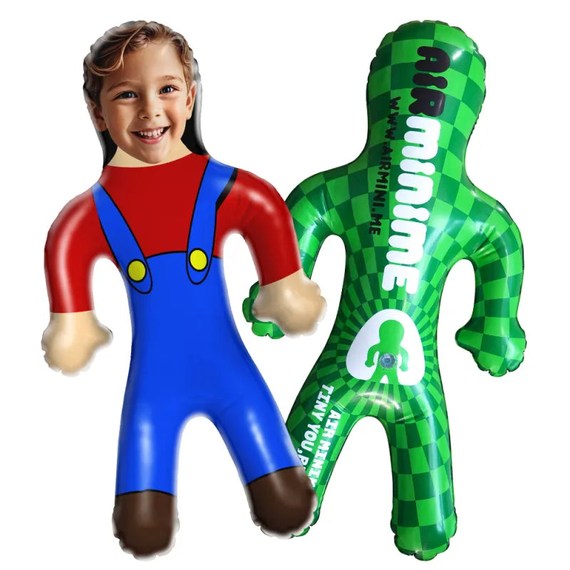 Inflatable character in red shirt and blue overalls next to a green inflatable figure with checkered pattern on a white background.