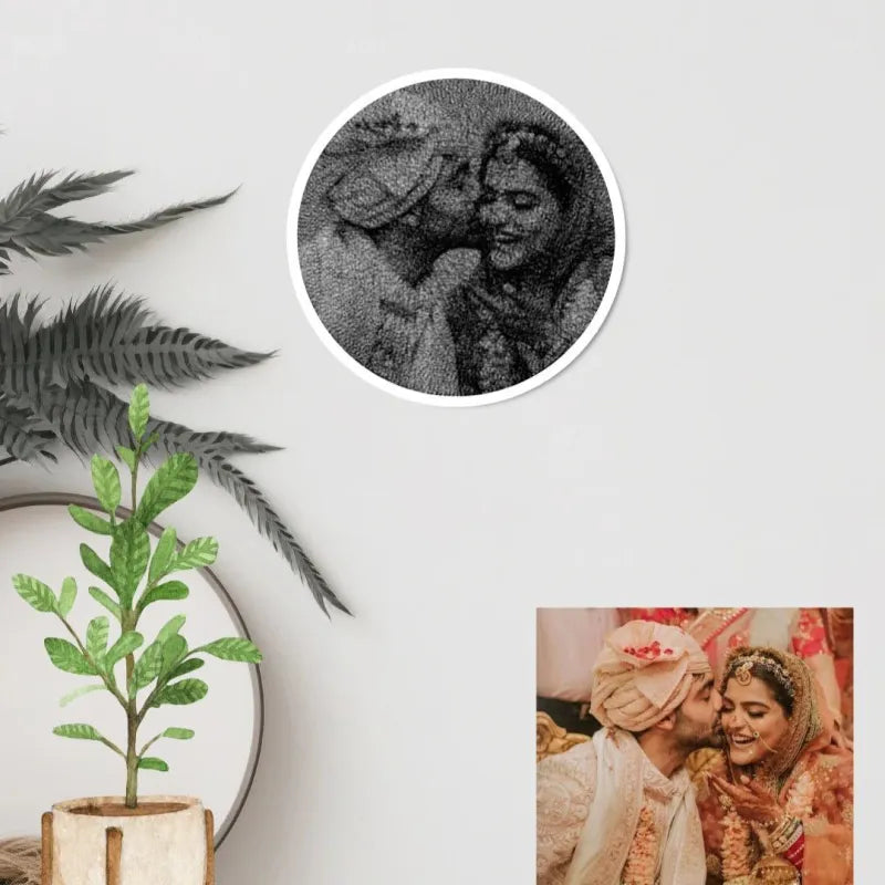Decorative wall art with a couple and a close-up of a woman's face on a light gray background.