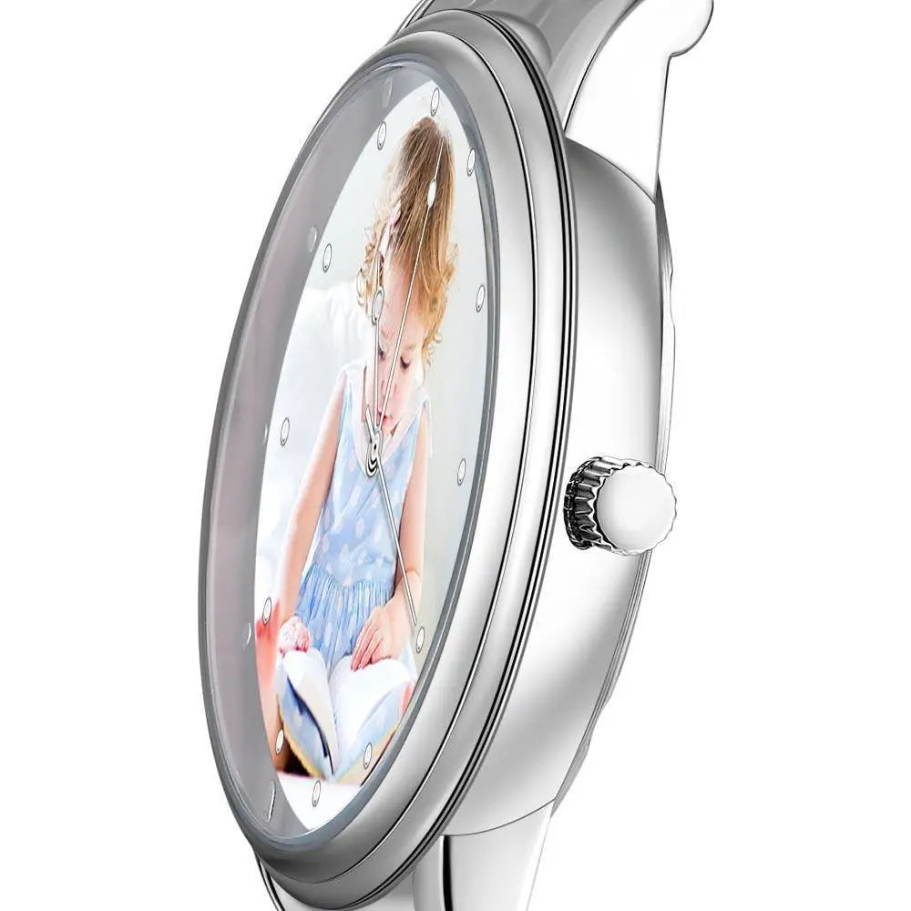 Silver watch with a photo of a child on the dial