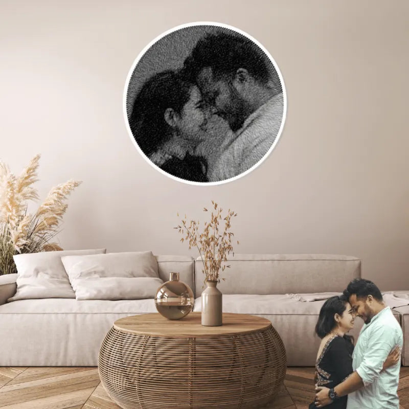 Living room with a couple embracing and a close-up inset of them kissing.